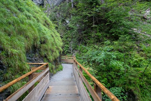 A hiking trail leading to An eerie landscape of a cave in Liechtensteinklamm narrow gorge in St. Johann im Pongau, Austria