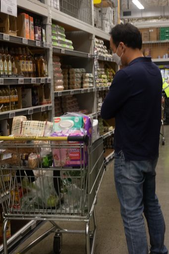 At Pak'n'Save Hornby in Christchurch New Zealand before the lockdown was put into place. People are stocking up on goods at a supermarket.