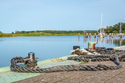 A marine mooring bollard on the dock