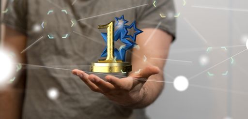 A 3D rendering of a first place golden award and male hand holding on a blurry background