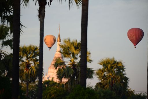 Hot air balloons soar over Bagan, Myanmar, during a stunning sunset.