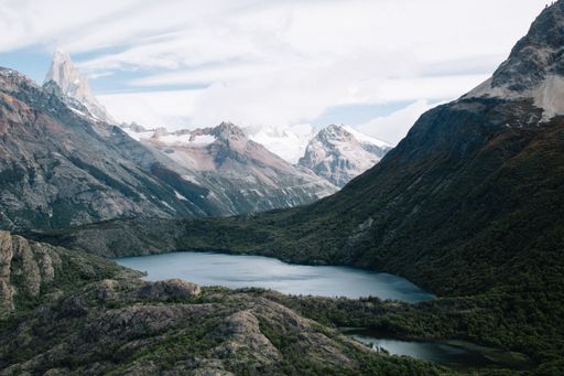 Serene mountain lake with lush greenery and peaks in Patagonia, Argentina