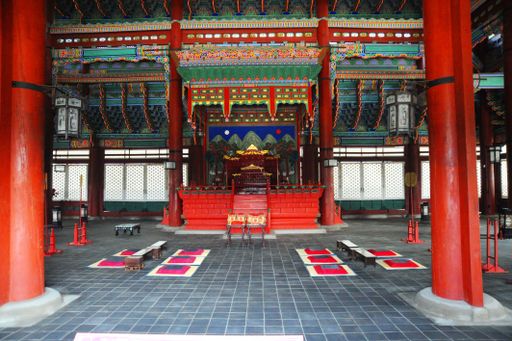 Traditional Korean palace interior with vibrant colors and intricate designs
