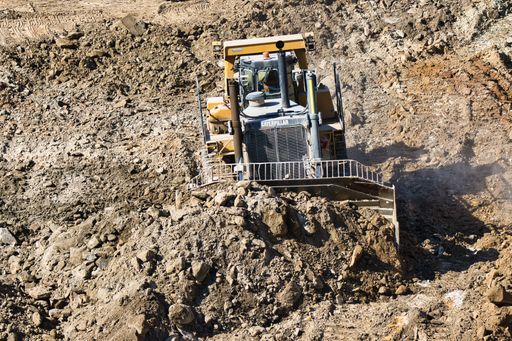 A Caterpillar D10R bulldozer excavating ground for the new building area in Sydney, Austalia