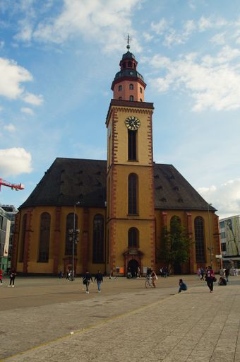 St. Catherine's Church at the Hauptwache in Frankfurt, Germany against a blue, cloudy summer sky. Built in 1681, reconstructed in 1954.