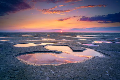 The Wadden Sea in the Netherlands during sunset with colorful clouds
