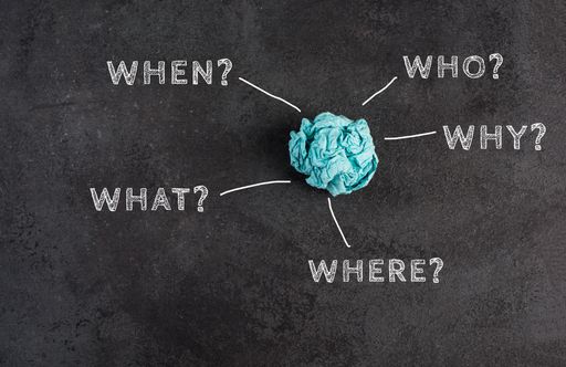Crumpled up paper on a blackboard, brainstorming, new idea, why, what, who?