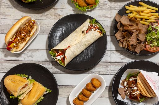 A closeup of various types of fast food on the table. Top view.