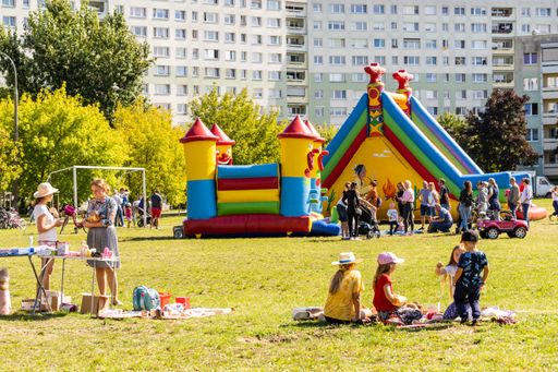 A colorful inflatable slide castle in a public park during the event in the Lecha district