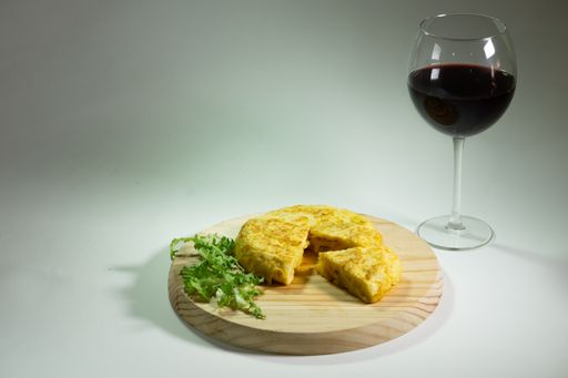 process of elaboration of potato omelette in spain in a frying pan