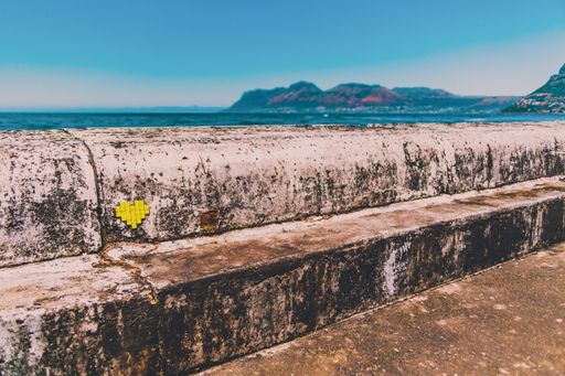 A small heart on a wall by the sea in Cape Town, South Africa