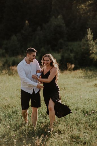 A Bosnian young loving couple hugging in the field