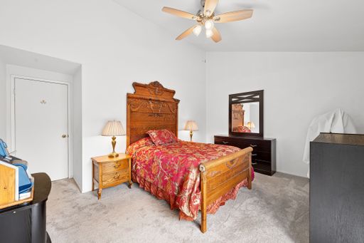 Various rooms of a suburban home including bedrooms, bathrooms, kitchen, and open living spaces with vaulted ceilings and ceiling fans.
