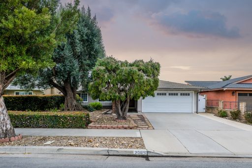 Various rooms of a suburban home including bedrooms, bathrooms, kitchen, and open living spaces with vaulted ceilings and ceiling fans.