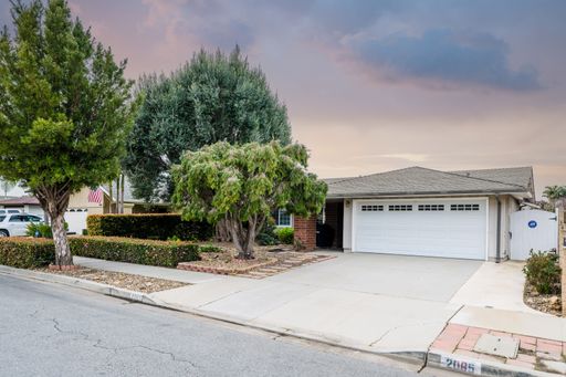 Various rooms of a suburban home including bedrooms, bathrooms, kitchen, and open living spaces with vaulted ceilings and ceiling fans.