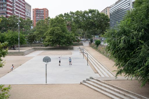 Young people playing basketball in the park