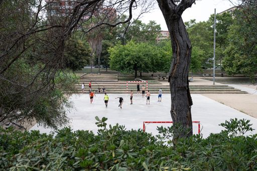 Young people playing football in the park
