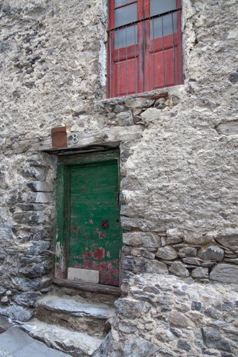 A vertical shot of the entrance of an old building in Andorra