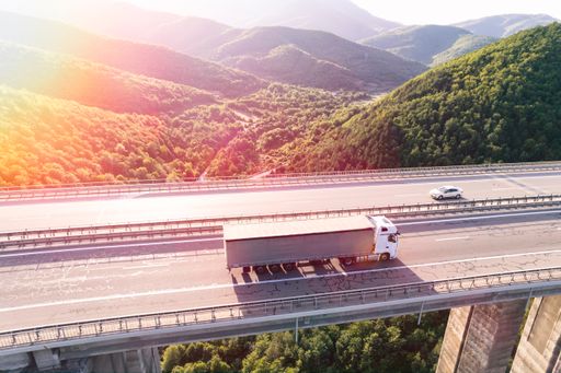 An aerial view of a cargo delivery truck on a highway
