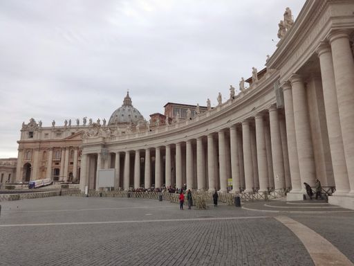 A front view of the St. Peter's Basilica in Vatican City on a cloudy day