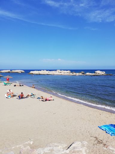 A vertical shot of the beautiful beach on the Costa Brava, Spain