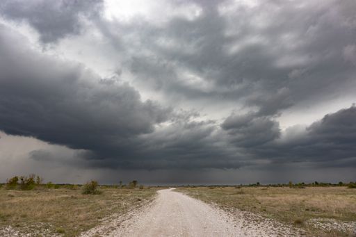 A mesmerizing shot of a road under the cloudy sky