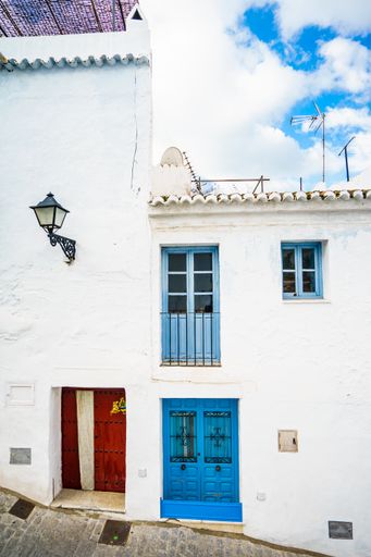 A blue-painted door of a building in Andalusia, Spain