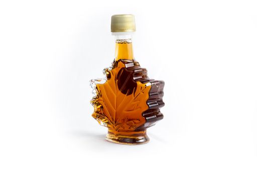 A closeup shot of a Canadian maple syrup isolated on a white background