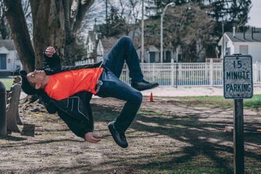 Man levitating in mid air at a rest stop. Man appears to be floating