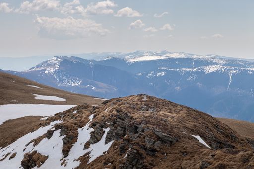 A mesmerizing view of the Old mountain with small snow areas against a cloudy sky in Serbia