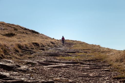 A tourist on the Old mountain in Serbia against a clear blue sky on a sunny day
