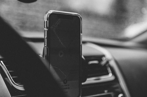 A grayscale shot of a smartphone with GPS on