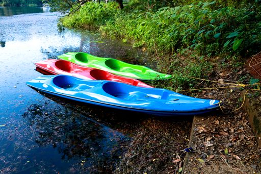A view of colorful canoes on the shore of the lake