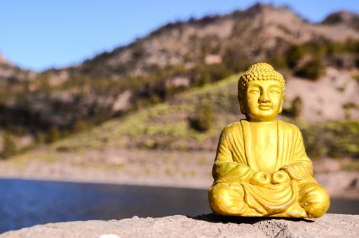 A selective focus shot of a statue of Buddha on the coast in Canary Islands, Spain