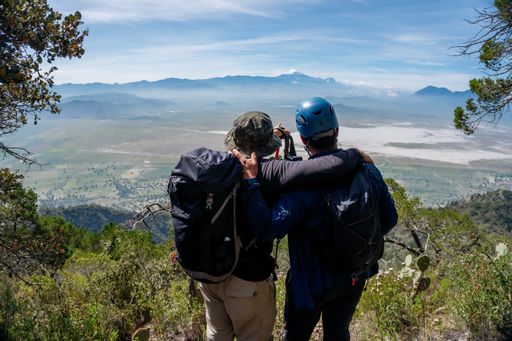 A shot of two friends looking at Pico de Orizaba in Puebla, Mexico