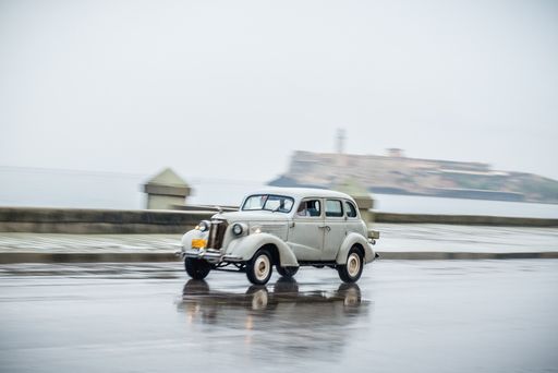 A car moving through Malecon an avenue next to the sea in La Habana, Cuba