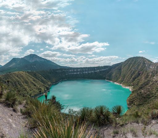 A shot of Laguna De San Luis Atexcac surrounded by mountains in Puebla, Mexico
