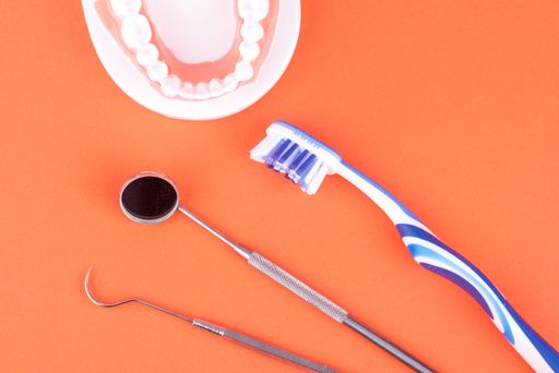 A top view shot of dental healthcare equipment isolated on the orange background