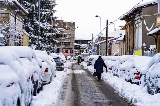 The people walking on a snowy trail in Bucharest, Romania