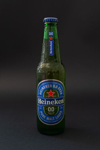 A bottle of Heineken 0.0 alcohol on dark background