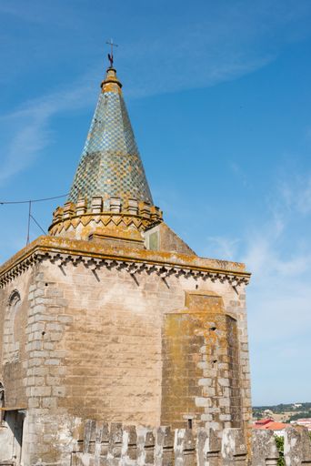 A scenic shot of a tower of the historical Cathedral of Evora in Portugal under the blue sky