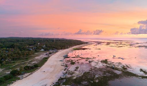 An aerial view of Nembrala beach, Rote, where surf taxi & fisherman boats are moored at bay - this is the main pick up spot for surfing T-land