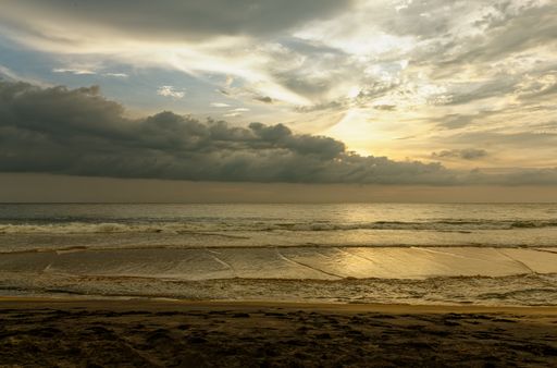 Sunset on the beach in Kerala, India on the Arabian Sea.