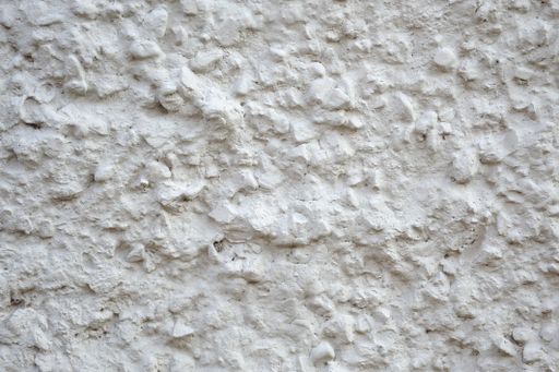 A closeup shot of a textured rough white surface