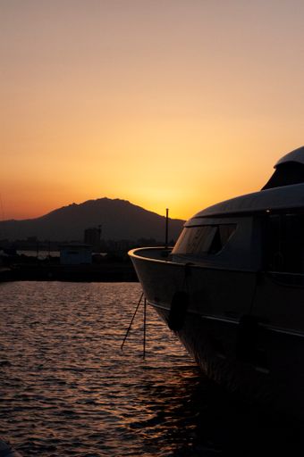 A beautiful view of marina di Olbia port and yacht marina at sunset