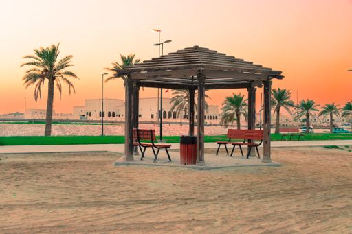 Beautiful Evening Landscape View Of Wooden Canopy Sitting Shade In Asker Beach, Bahrain