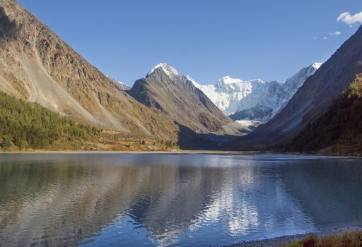 A scenic view of a lake on a mountainous landscape background