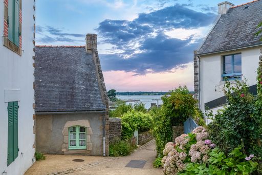 Brittany, Ile aux Moines island in the Morbihan gulf, small street and beautiful house with view of the sea
