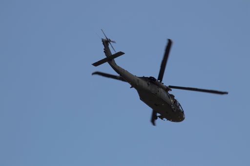 A helicopter flying in a cloudy sky in San Juan, Puerto Rico