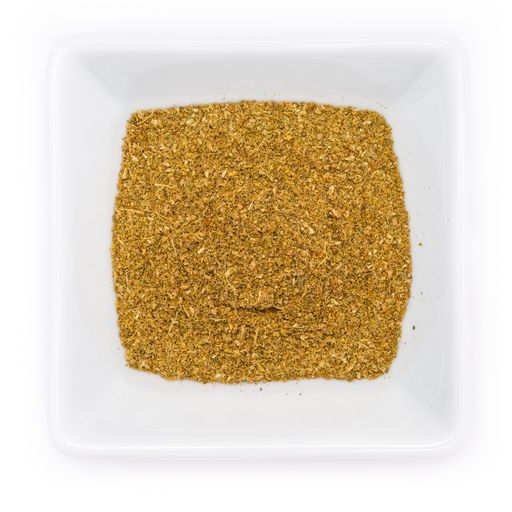 A top view of coriander, mint, curry powder spice in a white bowl